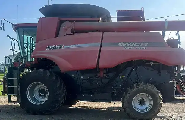 dirty combine with dirt, grease and grass smeared on
