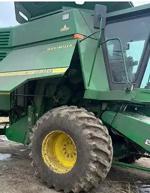 dirty combine with dirt, grease and grass smeared on