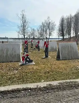 dirty sinage that depicts the 1800 british red coats both dirt and grass smeared on