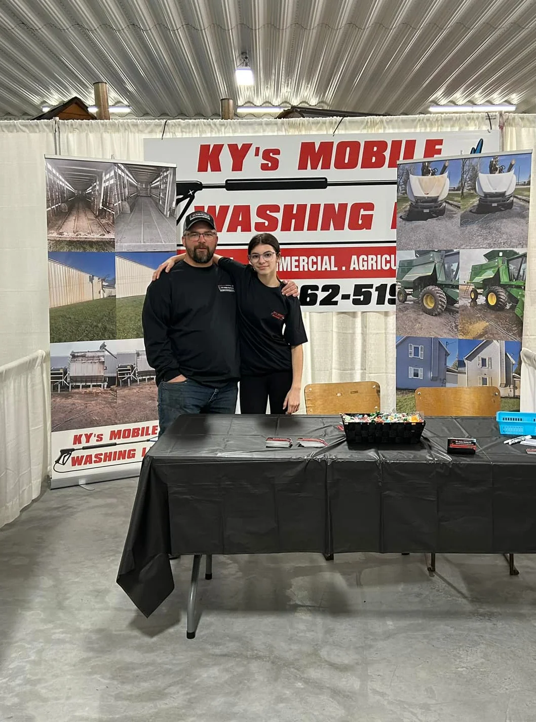 kyle at the trade show, with his daughter 