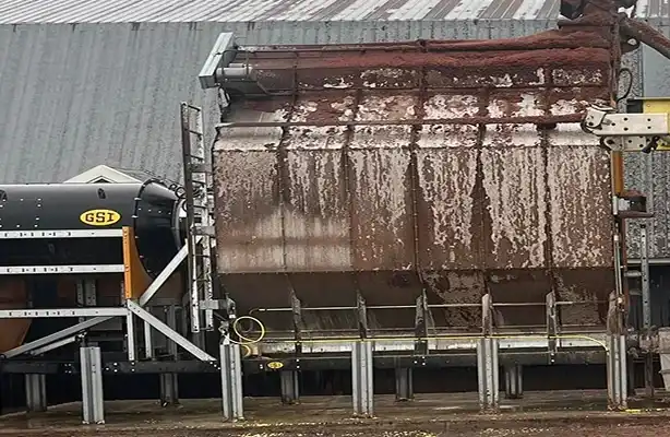 dirty grain bin with dirt and mud smeared on